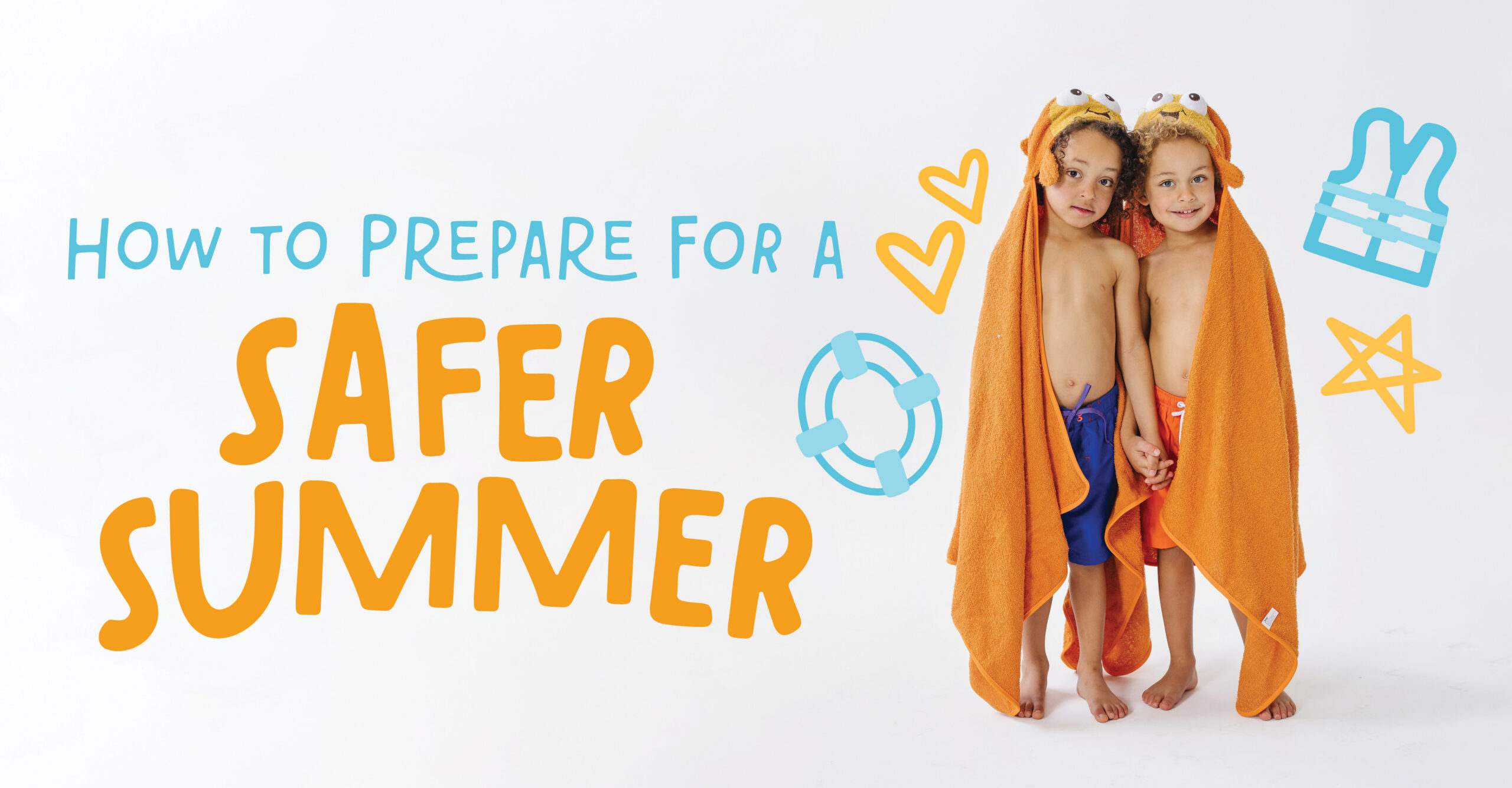 Two children in orange hooded towels smile brightly, excited to learn summer water safety skills at their weekly swim lesson.